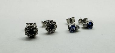 A PAIR OF 14CT WHITE GOLD STUD EARRINGS EACH SET WITH A BRILLIANT CUT DIAMOND AND BLUE STONE PLUS