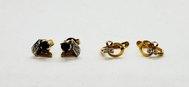 A PAIR OF STUD EARRINGS MARKED 585,