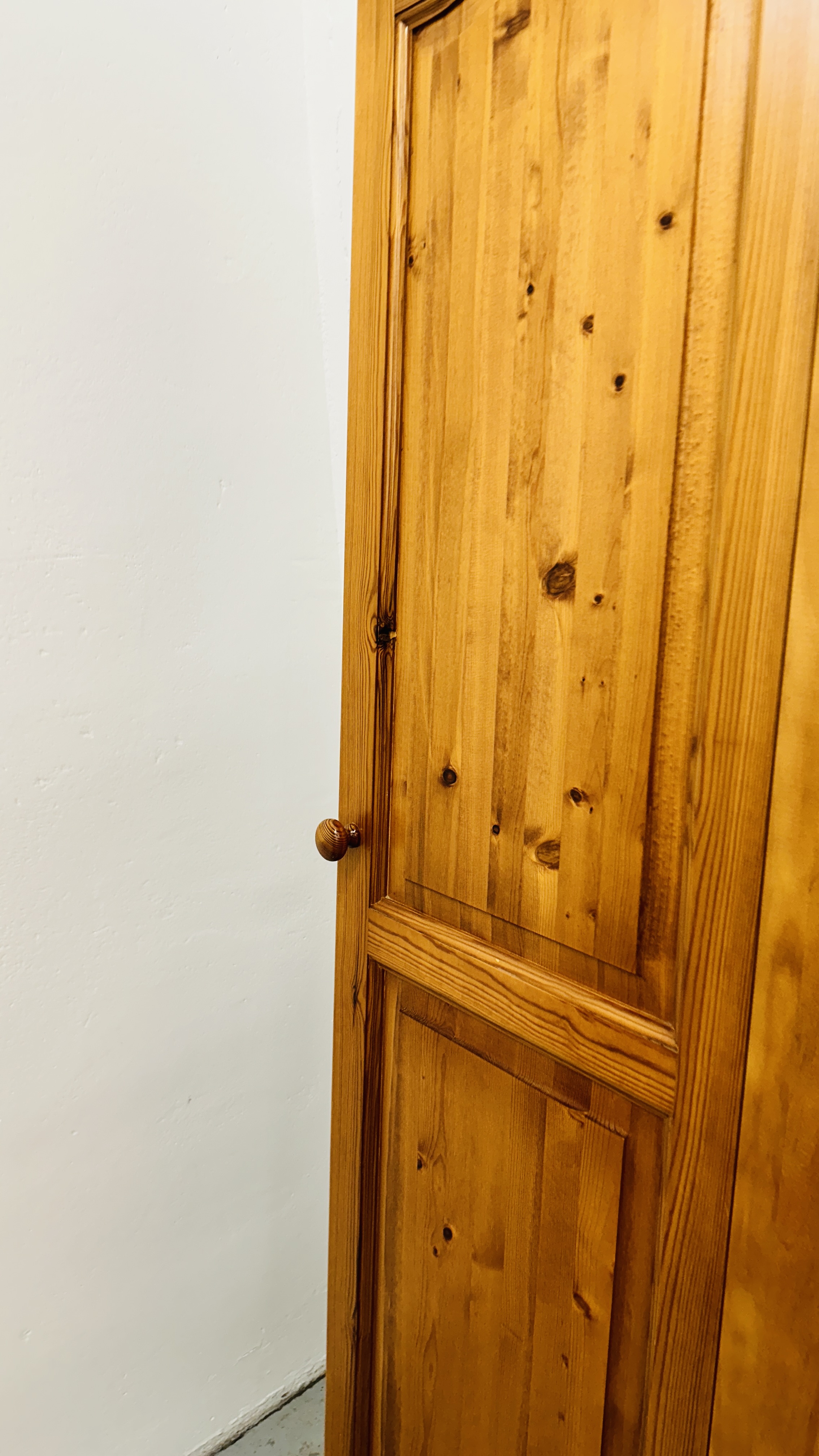 A HONEY PINE TWO DOOR WARDROBE AND A HONEY PINE TRIPLE WARDROBE (DISASSEMBLED). - Image 6 of 9