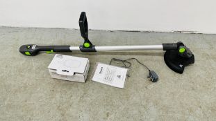 A GTECH CORDLESS GRASS TRIMMER WITH INSTRUCTIONS AND CHARGER - SOLD AS SEEN.