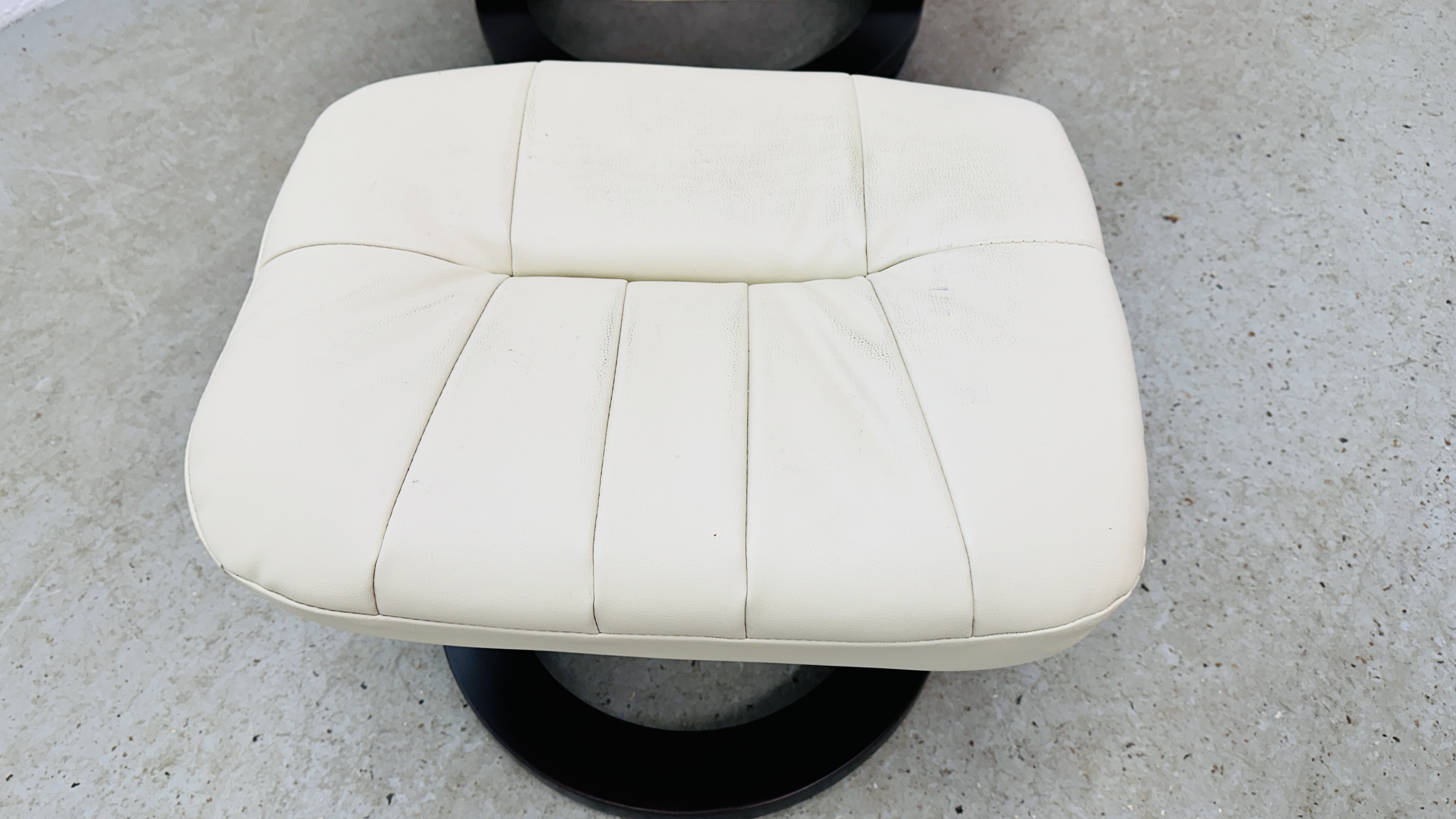 A MODERN CREAM FAUX LEATHER RECLINING RELAXER CHAIR AND FOOTSTOOL. - Image 10 of 12