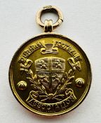 A VINTAGE 9CT GOLD MEDAL,