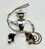 A SILVER COWBOY BROOCH BY "CHARLES HORNER" C1940 REG No. 857031, H 6CM (WITH ORIGINAL INVOICE).