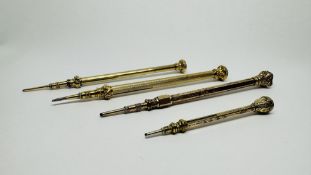 A GROUP OF 4 ORNATE ANTIQUE GILT METAL PROPELLING PENCILS, THE TOPS SET WITH SEMI PRECIOUS STONES ,