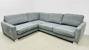 A CALEIDO SITS CORNER SOFA IN GREY WITH CHROME LEGS L 280CM X W 224CM X D 105CM.