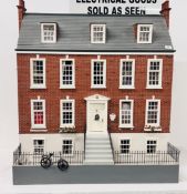 A LARGE WOODEN VICTORIAN STYLE DOLLS HOUSE - W 91CM X H 101CM X D 58CM COMPLETE WITH FURNISHINGS -