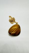 A 9CT GOLD CHAIN ALONG WITH A 9CT GOLD TIGER EYE PENDANT BROOCH.