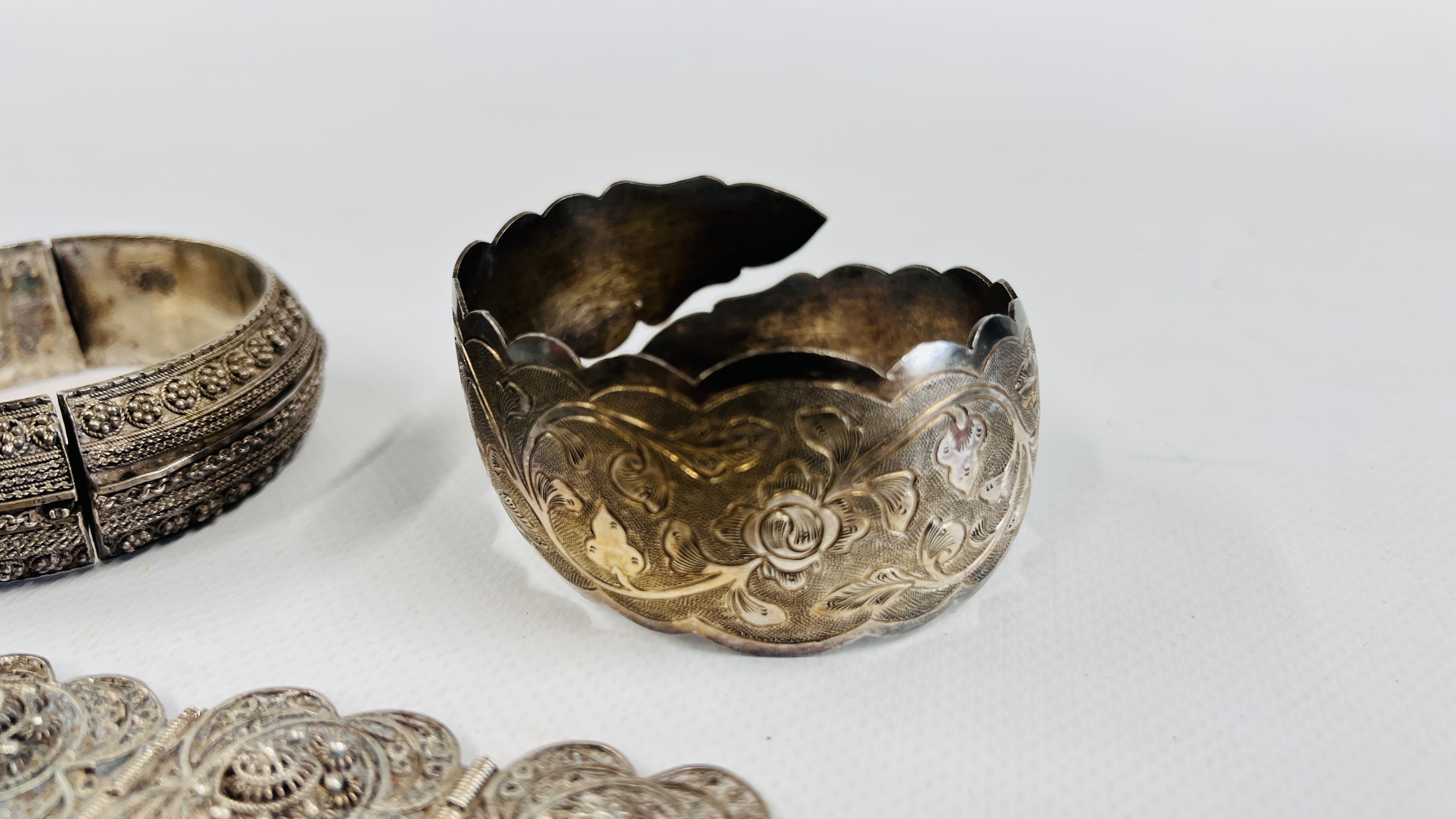 A GROUP OF FOUR SILVER EASTERN BRACELETS TO INCLUDE AN ENGRAVED CUFF, - Image 6 of 9