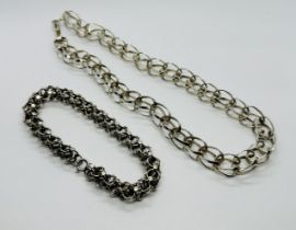 A DESIGNER SILVER INTERTWINED CHOKER STYLE NECKLACE ALONG WITH A WHITE METAL MULTI LINK BRACELET OF