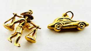 TWO 9CT GOLD CHARM / PENDANTS TO INCLUDE A RACING CAR AND A MARKET SELLER.