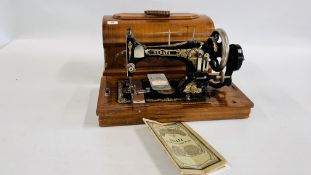 A VINTAGE "SERATA" SEWING MACHINE IN FITTED MARQUETRY INLAID CASE ALONG WITH VARIOUS ACCESSORIES