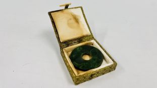 A VINTAGE JADE DISK WITH SEAL.