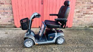 A PRIDE COLT DELUX MOBILITY SCOOTER COMPLETE WITH CHARGER - NO KEY - SOLD AS SEEN.