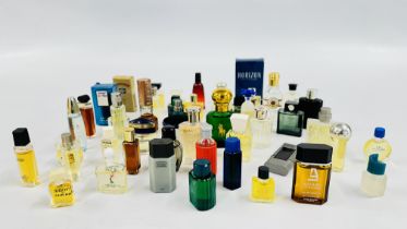 A BASKET OF VINTAGE GENT'S PERFUMES TO INCLUDE CARTIER, FABERGE, YSL ETC.