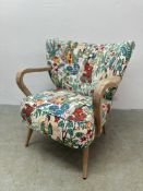 A MODERN HOME CRAFTED G & G DESIGNER ARM CHAIR WITH EASTERN DECORATED UPHOLSTERY.