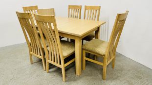 A MODERN LIMED OAK FINISH EXTENDING DINING TABLE (AND EXTRA LEAF) & A SET OF 6 UPHOLSTERED DINING