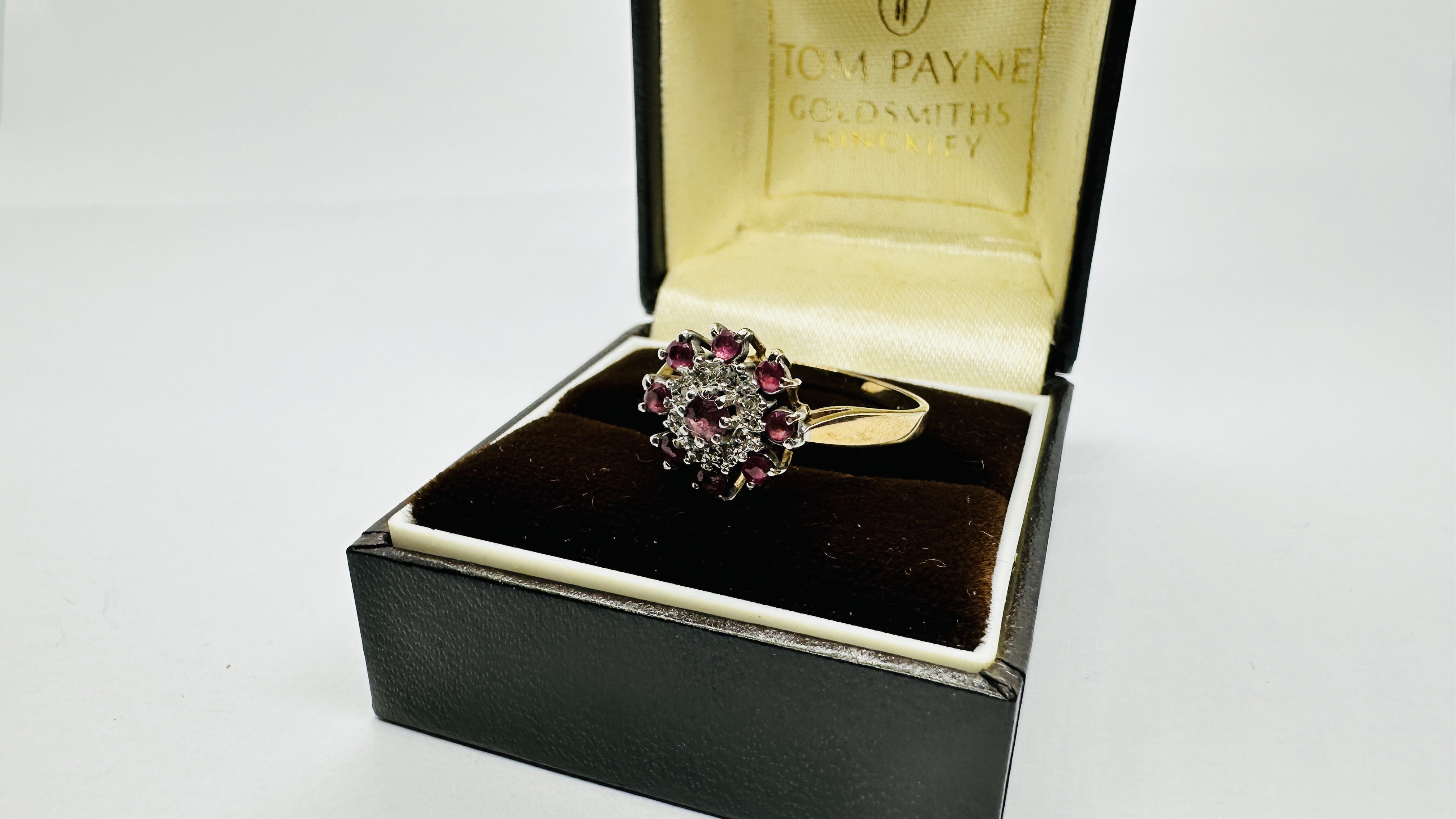 A 9CT GOLD RUBY AND DIAMOND CLUSTER RING. SIZE P/Q. - Image 9 of 11