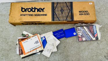 A BROTHER'S MODEL KH-830 KNITTING MACHINE IN ORIGINAL BOX ALONG WITH SEWING PATTERNS - SOLD AS SEEN.