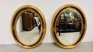 A PAIR OF OVAL GILT FINISH VINTAGE STYLE WALL MIRRORS H 86 X W 67CM.