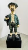 A VINTAGE RESIN FIGURE OF A GOLFER STANDING ON SQUARE BASE - H 114CM.