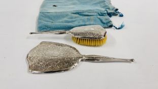 A STERLING SILVER BIRKS DRESSING TABLE HAND BRUSH AND MATCHING MIRROR THE BACK HAVING A MONOGRAM.