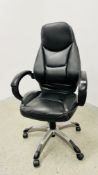 A BLACK FAUX LEATHER REVOLVING EXECUTIVE OFFICE CHAIR.