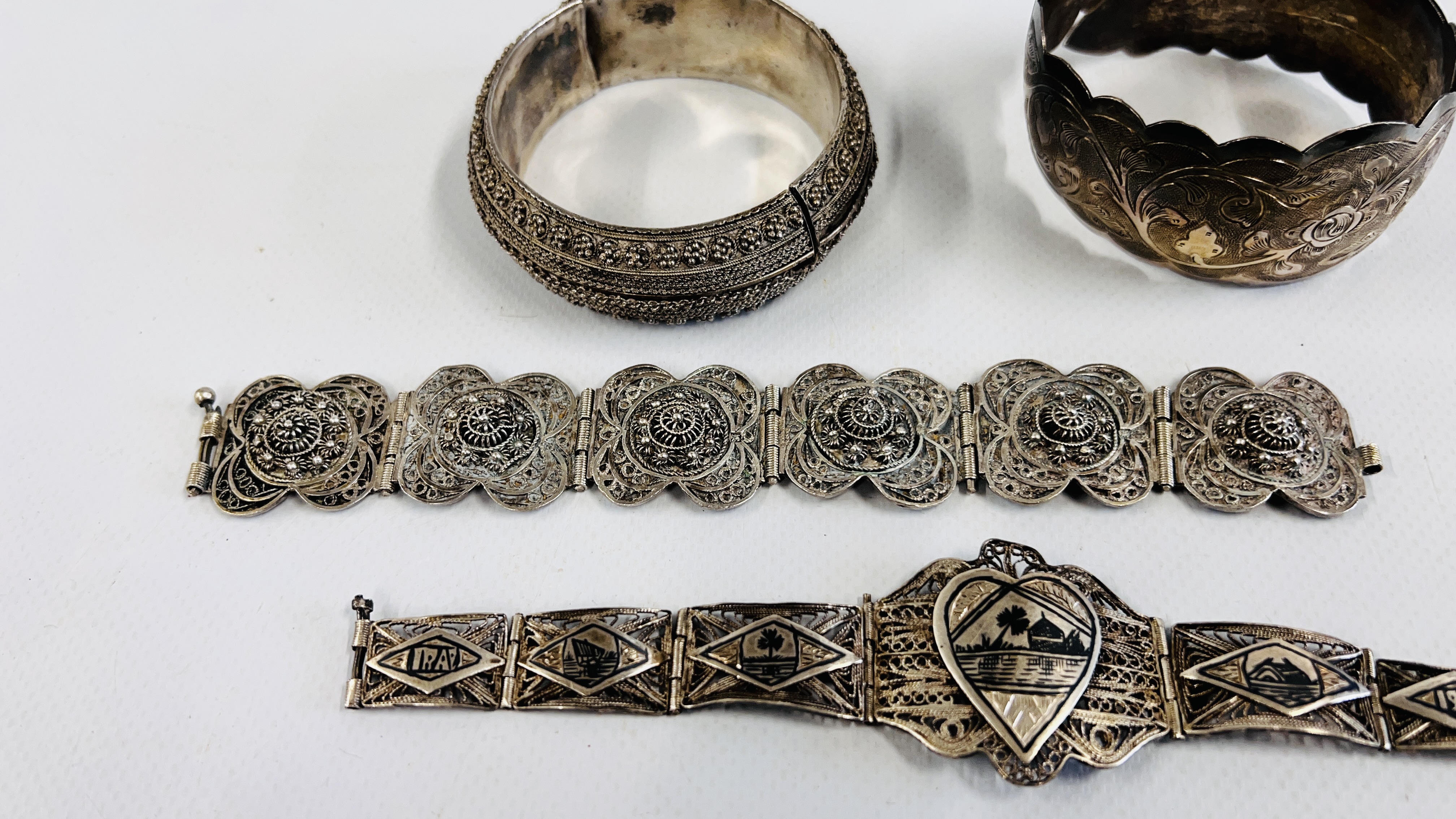 A GROUP OF FOUR SILVER EASTERN BRACELETS TO INCLUDE AN ENGRAVED CUFF, - Image 5 of 9