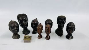 A GROUP OF ETHNIC HARDWOOD CARVED HEADS.