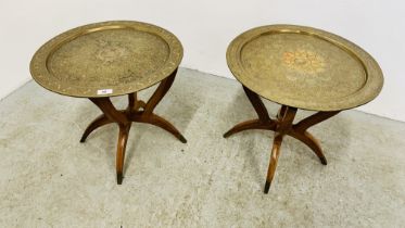 A PAIR OF EASTERN DESIGN BRASS TOPPED OCCASIONAL TABLES.