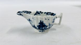 A LOWESTOFT BLUE AND WHITE SAUCEBOAT OF FLUTED OVAL FORM WITH ANGULAR HANDLE,