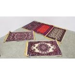 FIVE VARIOUS SMALL PERSIAN STYLE RUGS EACH 110CM X 68CM.