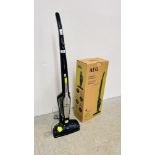 AN AEG XFLEXIBILITY VACUUM CLEANER WITH CHARGER - SOLD AS SEEN.