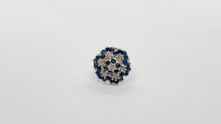 A 9CT GOLD DIAMOND AND SAPPHIRE CLUSTER RING.