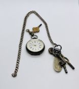 A SILVER CASED FOB WATCH WITH ORNATE ENAMELED DIAL AND A SILVER WATCH CHAIN AND VARIOUS KEYS.