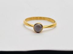 AN ANTIQUE 22CT GOLD RING SET WITH A CENTRAL HARD STONE IN A VINTAGE VELVET BOX MARKED "JOHN D.