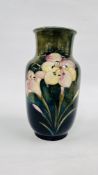 A LARGE WILLIAM MOORCROFT "YELLOW LILY" DESIGN BALUSTER VASE, THE BASE WITH INITIALS WM 1950 - H 31.