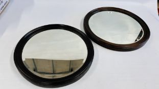 TWO VINTAGE OAK FRAMED CIRCULAR MIRRORS, DIAMETER OF LARGEST - 58CM.