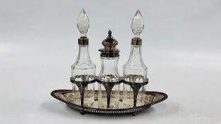 A SILVER PLATED THREE BOTTLE CRUETTE.