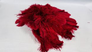 A RED OSTRICH FEATHER VINTAGE CAPE.