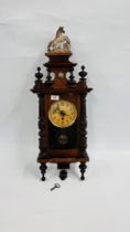 A MAHOGANY CASED WALL CLOCK.