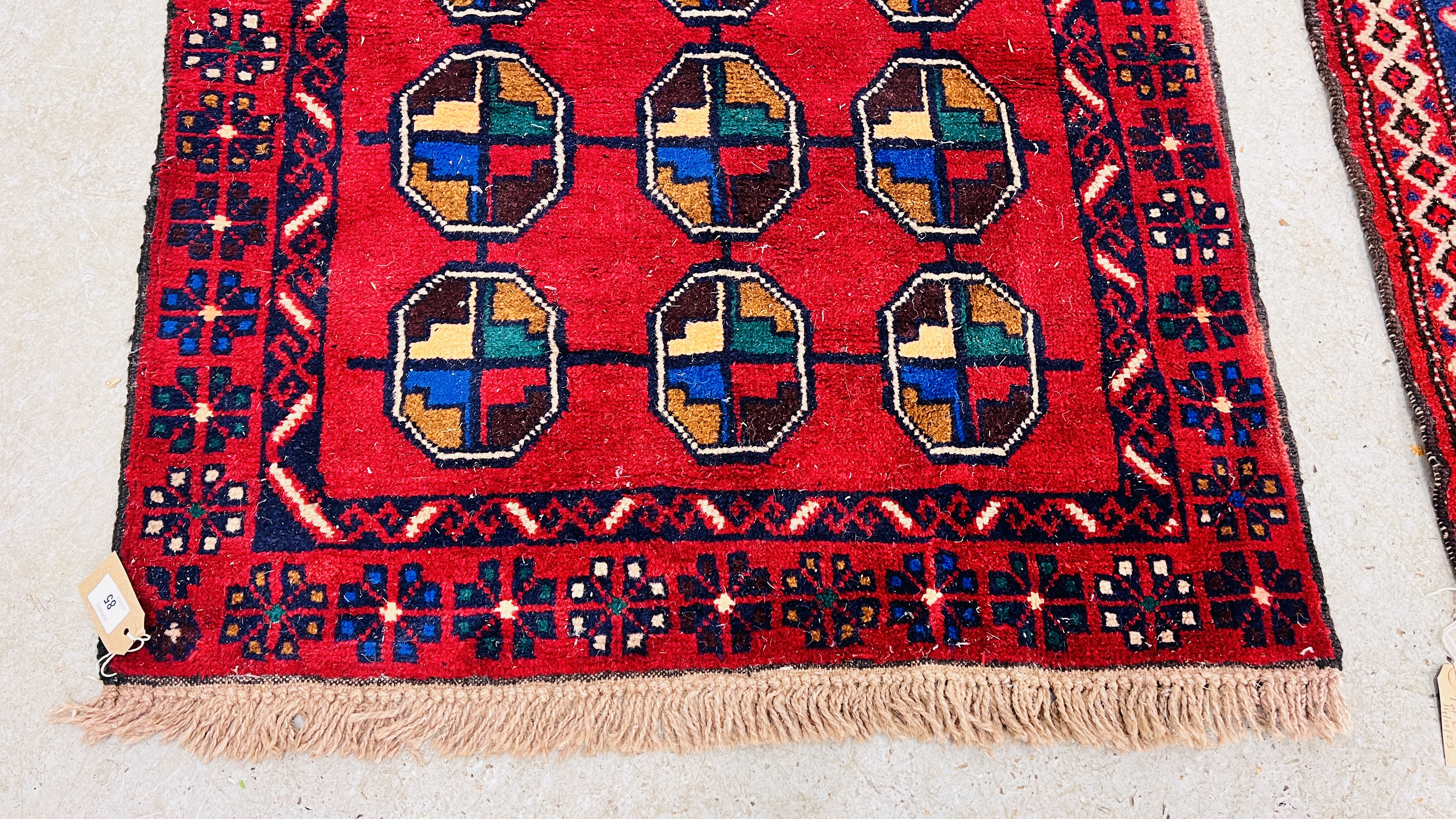 TWO RED / BLUE PATTERNED EASTERN RUGS EACH 133CM X 86CM. - Image 7 of 10