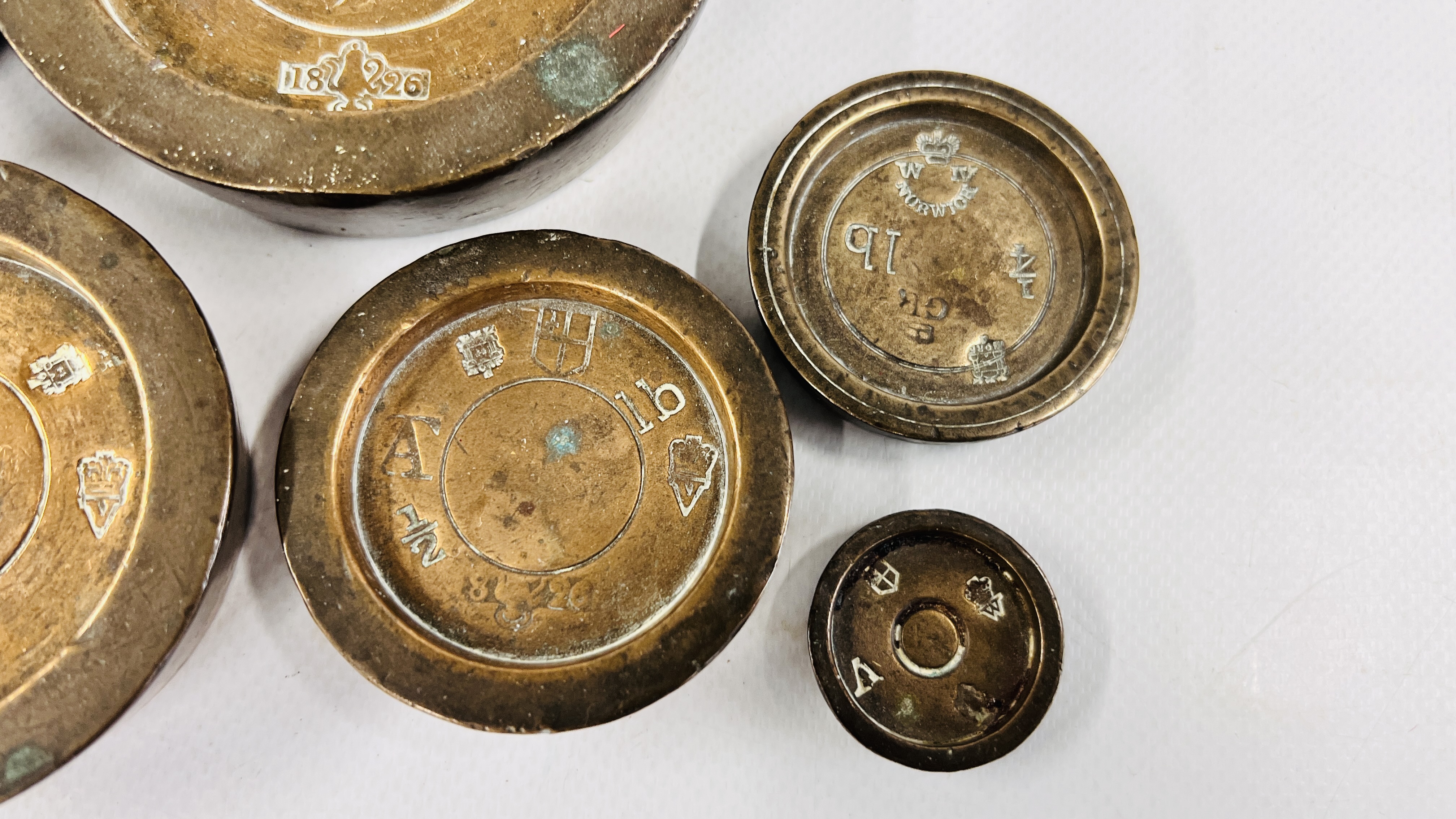 A GROUP OF 6 VINTAGE GRADUATED WEIGHTS OF LOCAL INTEREST ALONG WITH A CAST MORTAR. - Image 10 of 11