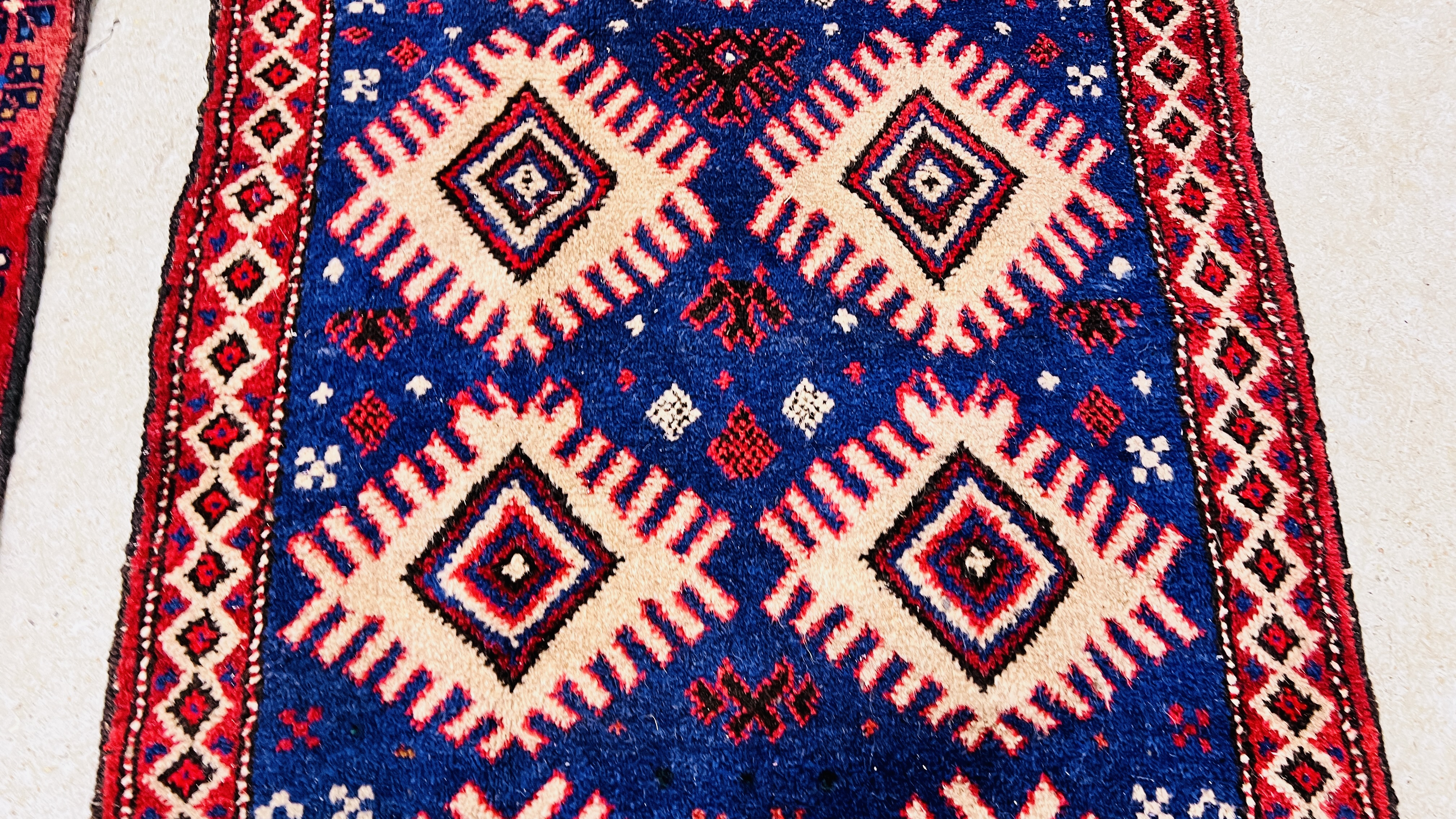 TWO RED / BLUE PATTERNED EASTERN RUGS EACH 133CM X 86CM. - Image 4 of 10
