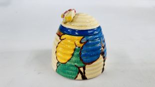 A CLARICE CLIFF BIZARRE PATTERN HONEY POT AND COVER,