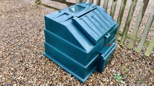 A SOLID GREEN PLASTIC COAL BUNKER WITH TOP AND FRONT ACCESS.