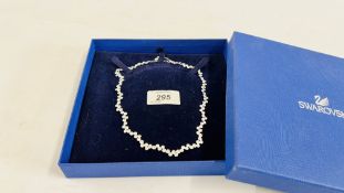 A DESIGNER EVENING CHOKER STYLE NECKLACE MARKED "SWAROVSKI" IN FITTED BOX.