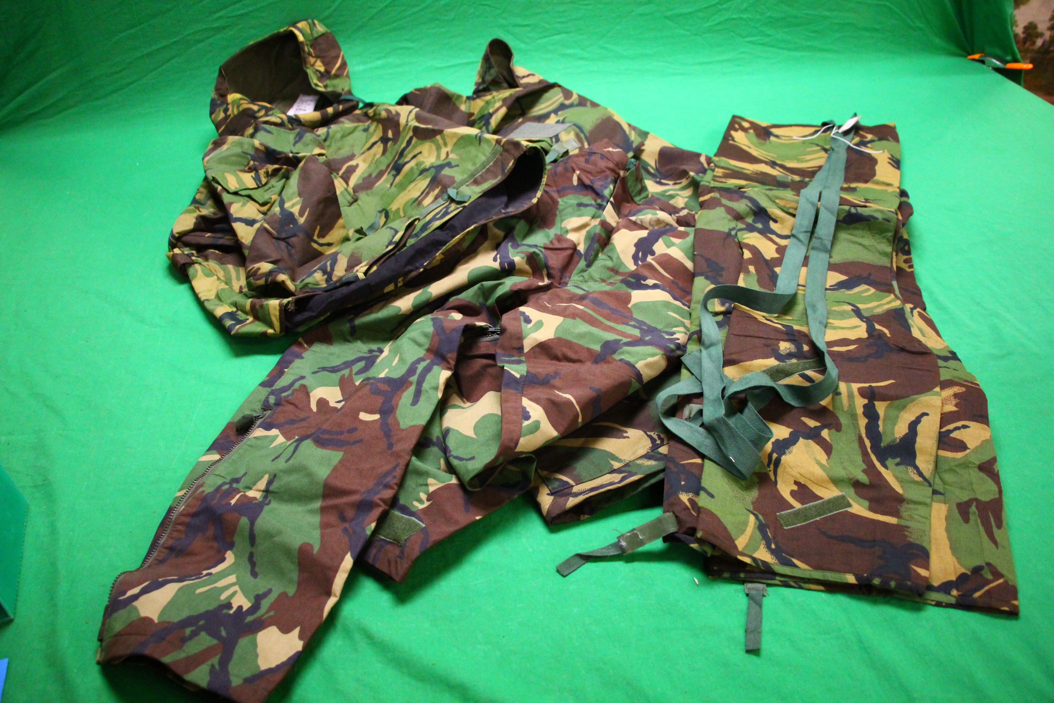 AS NEW CAMOFLAGE CLOTHING TO INCLUDE JACKET, TROUSERS,
