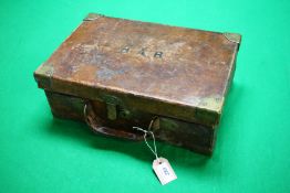 AN ANTIQUE LEATHER AND BRASS BOUND CARTRIDGE CASE BEARING LABEL "WESTLEY RICHARDS & Co" LID BRANDED