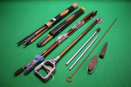 A COLLECTION OF GUN CLEANING RODS AND SHOOTING STICK