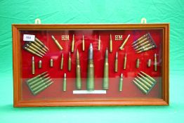 A FRAMED AND MOUNTED WW2 BRITISH MILITARY SMALL ARMS AMMUNITION COLLECTION